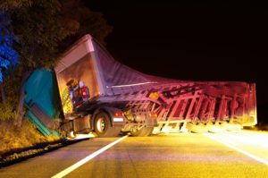 A semitruck overturned from accident, if injury in a wreck meet with Truck Accident Attorney Near Me.