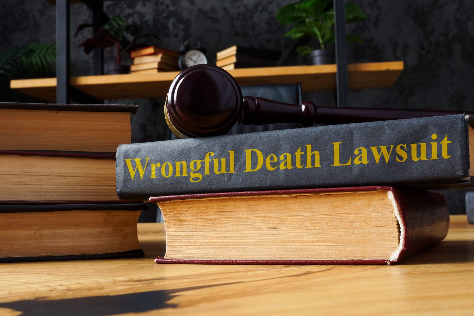 A gavel rests on a book titled "Wrongful Death Lawsuit," when working with wrongful death lawyer Hampton